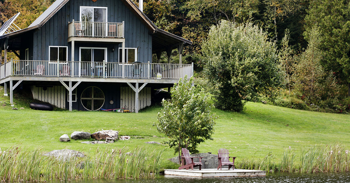 A lake house in a wooded area