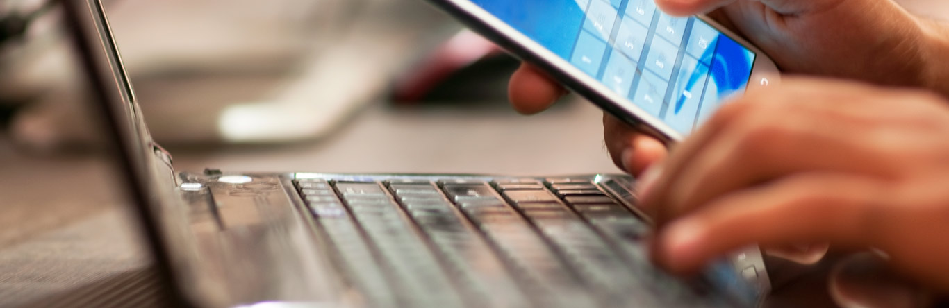 Title rates person using cell phone and laptop
